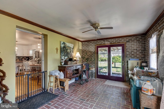 sunroom featuring french doors and a wood stove