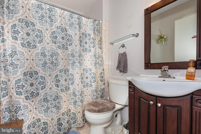 bathroom with vanity, a shower with curtain, and toilet