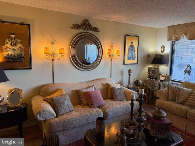 living room featuring a textured ceiling