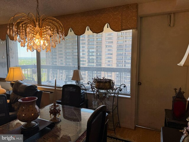 dining room with a wealth of natural light and a chandelier