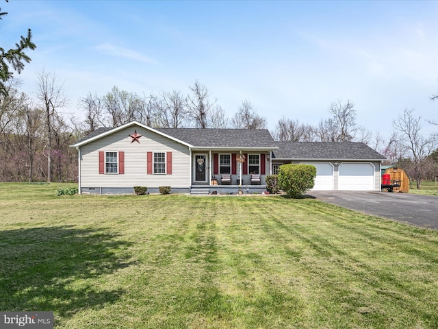 ranch-style home featuring a front lawn, driveway, an attached garage, and covered porch
