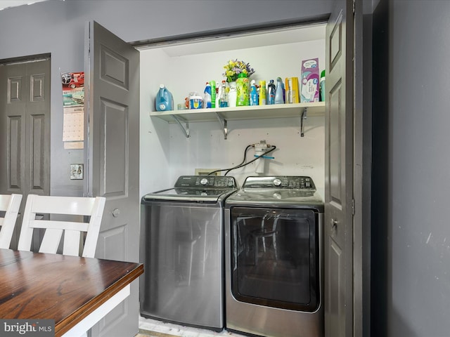 laundry room with laundry area and washing machine and dryer