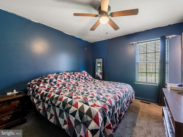 bedroom with carpet, visible vents, a ceiling fan, and baseboards