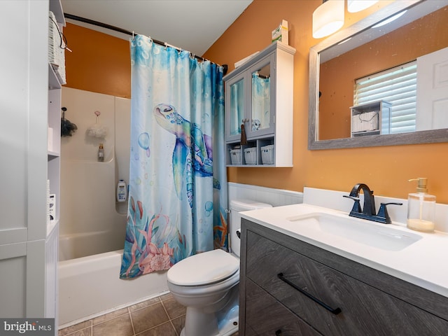 full bath featuring toilet, tile patterned flooring, shower / tub combo, and vanity