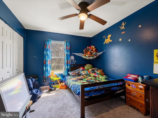 bedroom featuring a closet, a ceiling fan, and carpet