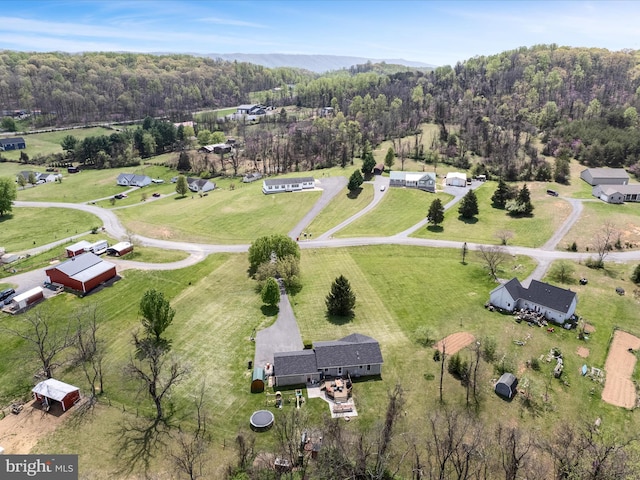 bird's eye view featuring a rural view and a view of trees