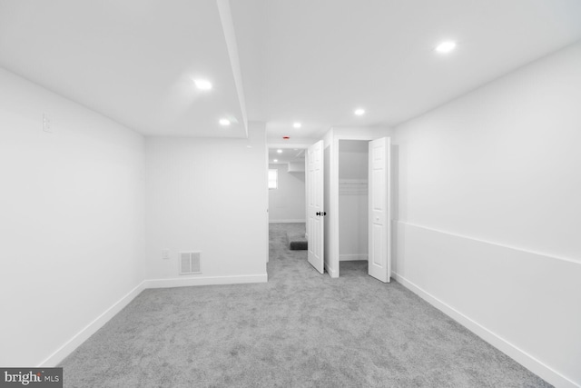 unfurnished bedroom with recessed lighting, visible vents, baseboards, and carpet