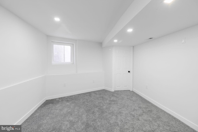 carpeted empty room featuring recessed lighting and baseboards