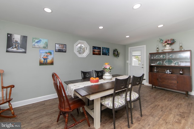 dining room featuring wood finished floors and recessed lighting