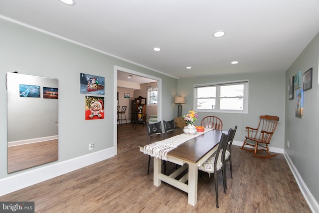 dining area with recessed lighting, baseboards, and wood finished floors