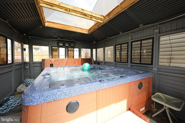 exterior space with a hot tub