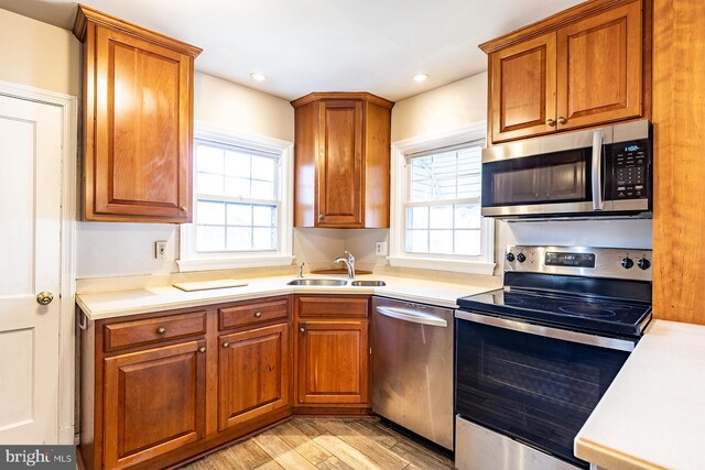 526 Baltimore Annapolis Blvd, Severna Park, MD 21146 - kitchen featuring plenty of natural light, brown cabinets, stainless steel appliances, and a sink