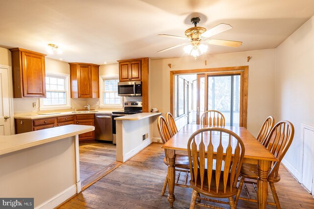 526 Baltimore Annapolis Blvd, Severna Park, MD 21146 - dining area with visible vents, baseboards, light wood-style floors, and ceiling fan