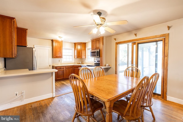 526 Baltimore Annapolis Blvd, Severna Park, MD 21146 - dining area featuring light wood finished floors, ceiling fan, and baseboards
