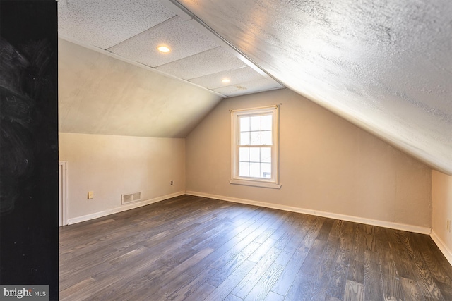 526 Baltimore Annapolis Blvd, Severna Park, MD 21146 - bonus room featuring visible vents, baseboards, dark wood-type flooring, and vaulted ceiling