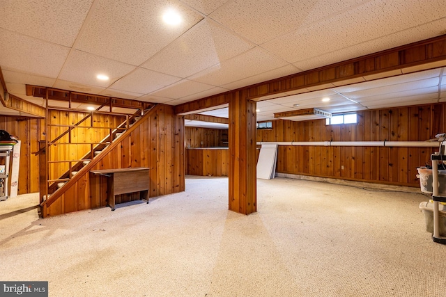 526 Baltimore Annapolis Blvd, Severna Park, MD 21146 - basement featuring carpet flooring, stairway, wooden walls, and a drop ceiling