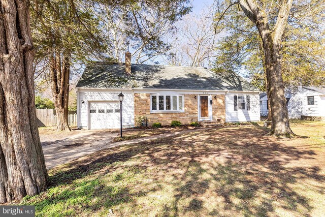 526 Baltimore Annapolis Blvd, Severna Park, MD 21146 - view of front of home with stone siding, fence, concrete driveway, a garage, and a chimney