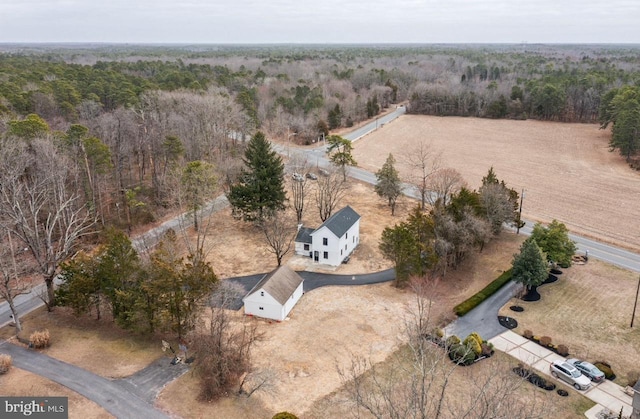 drone / aerial view with a rural view and a wooded view