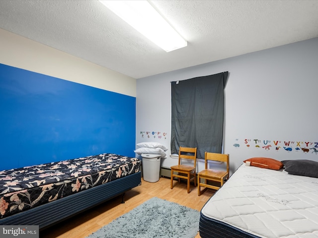4137 Hedgesville Rd, Hedgesville, WV 25427 - bedroom with wood finished floors and a textured ceiling