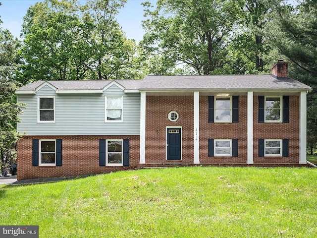 4137 Hedgesville Rd, Hedgesville, WV 25427 - view of front of property featuring a chimney, a front lawn, and brick siding