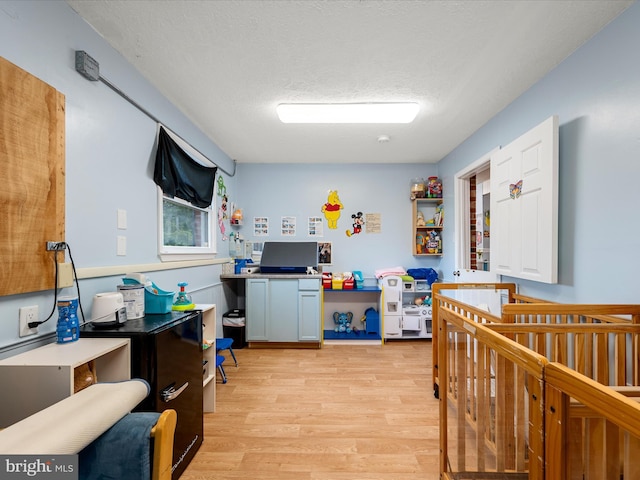 4137 Hedgesville Rd, Hedgesville, WV 25427 - rec room with light wood-style floors and a textured ceiling