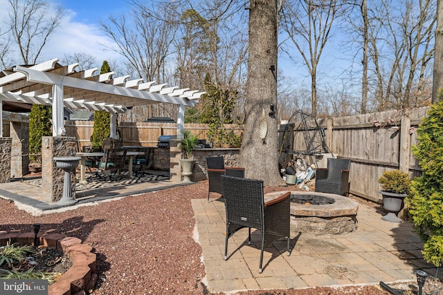 view of patio / terrace featuring a fire pit, a fenced backyard, and a pergola