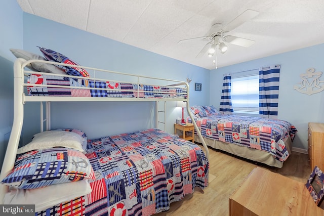 bedroom featuring wood finished floors and ceiling fan