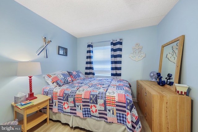 bedroom with wood finished floors