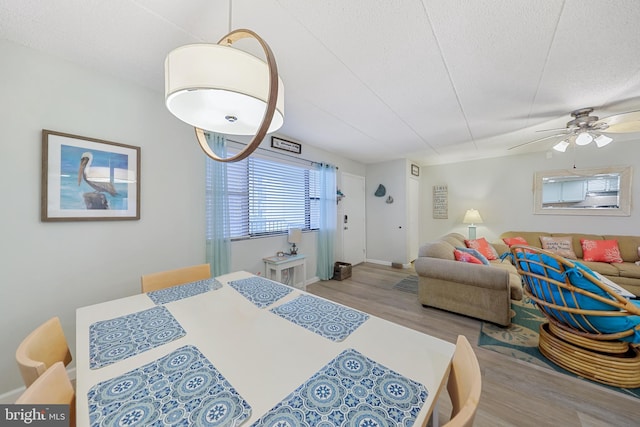 bedroom featuring wood finished floors and a textured ceiling