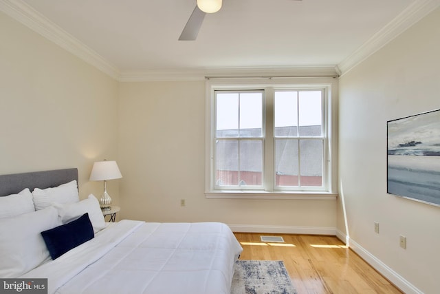 1210 R St NW Unit 313, Washington, DC 20009 - bedroom with ornamental molding, baseboards, wood finished floors, and a ceiling fan