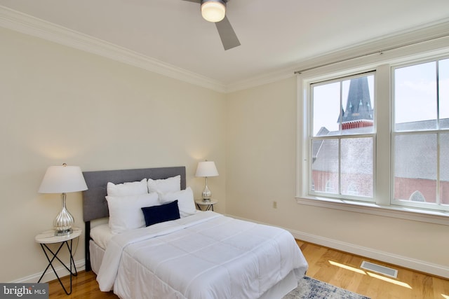 1210 R St NW Unit 313, Washington, DC 20009 - bedroom with baseboards, multiple windows, ornamental molding, and wood finished floors