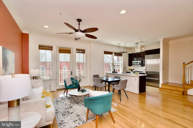 1210 R St NW Unit 313, Washington, DC 20009 - living area with stairs, crown molding, light wood finished floors, a ceiling fan, and recessed lighting