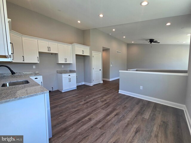 211 Greenland Beach Rd, Baltimore, MD 21226 - kitchen with a sink, white cabinetry, a ceiling fan, and light stone countertops
