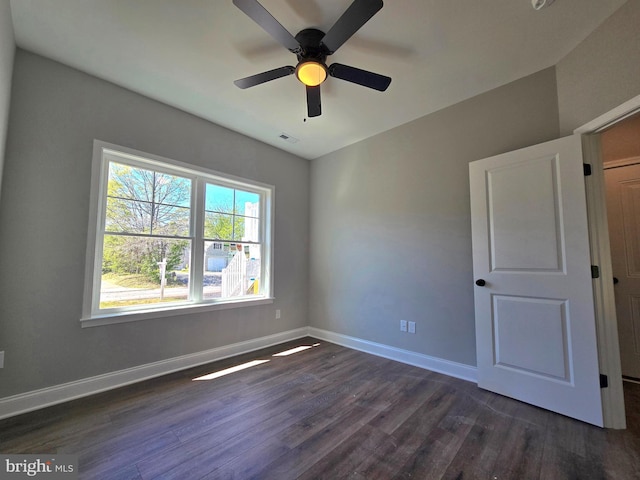 211 Greenland Beach Rd, Baltimore, MD 21226 - empty room with baseboards, ceiling fan, visible vents, and dark wood-type flooring