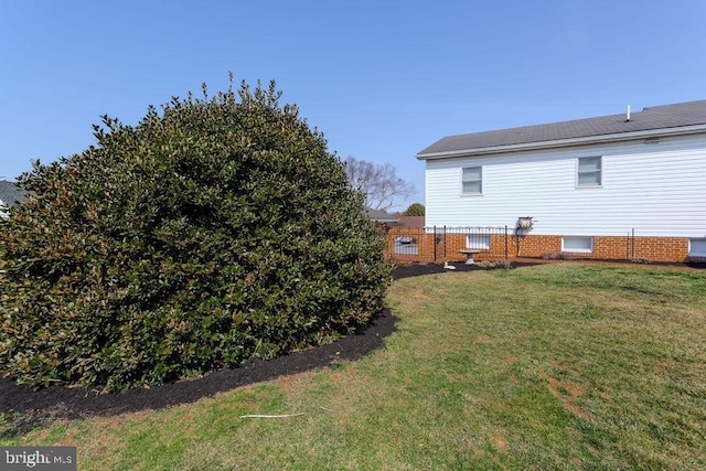 exterior space with a yard and fence