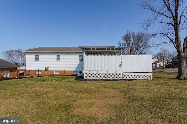 back of house with a lawn