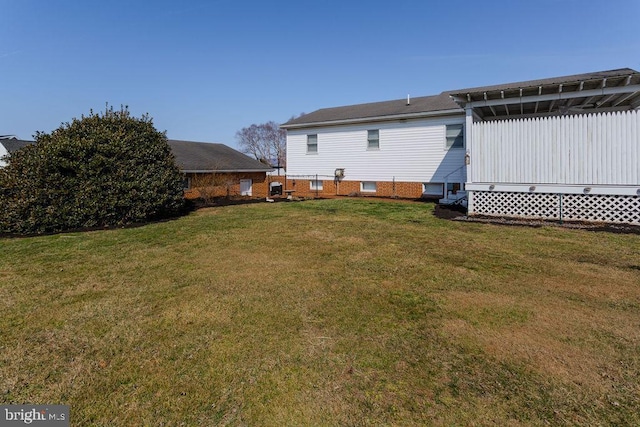 back of property featuring a lawn
