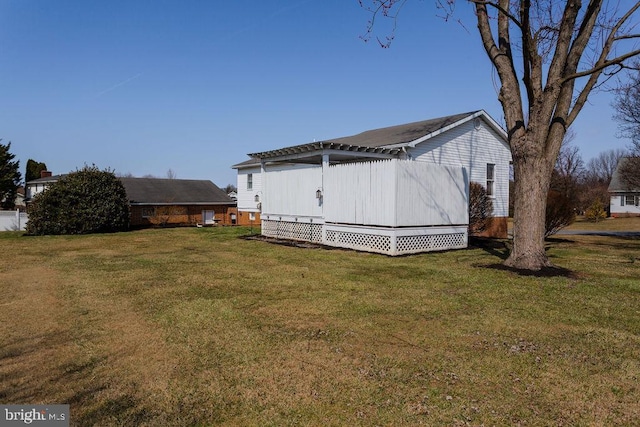 view of property exterior with a yard