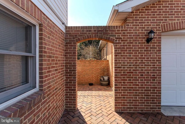 view of patio featuring a garage