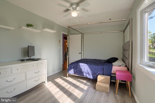 bedroom featuring baseboards and light wood-type flooring