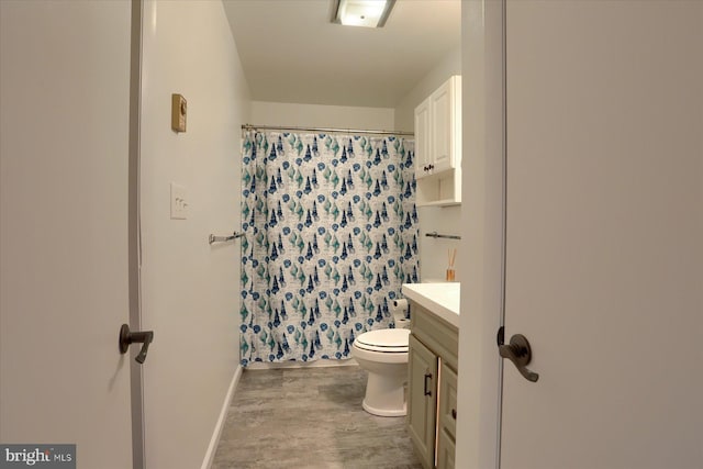 full bath with vanity, wood finished floors, toilet, and a shower with curtain