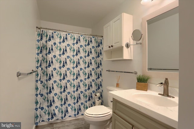 bathroom with vanity, toilet, and curtained shower