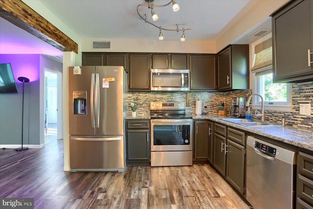 kitchen with light wood-style floors, a sink, appliances with stainless steel finishes, and visible vents