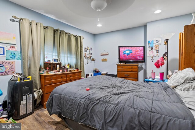 bedroom with recessed lighting, a ceiling fan, and wood finished floors