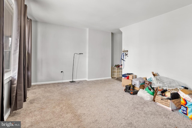 game room featuring baseboards and carpet