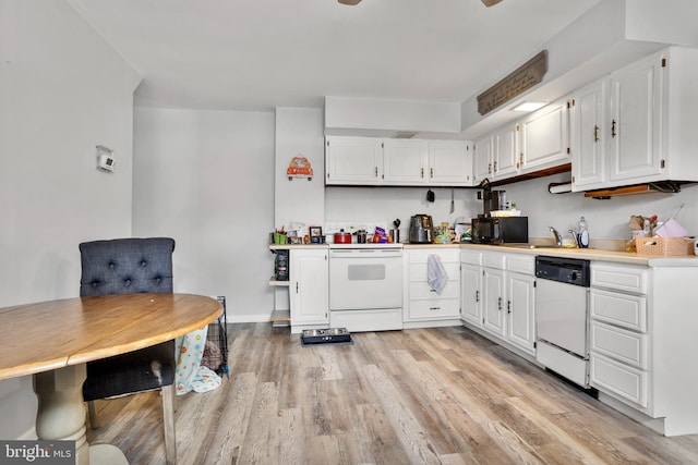 kitchen featuring white appliances, a sink, light countertops, white cabinets, and light wood-type flooring