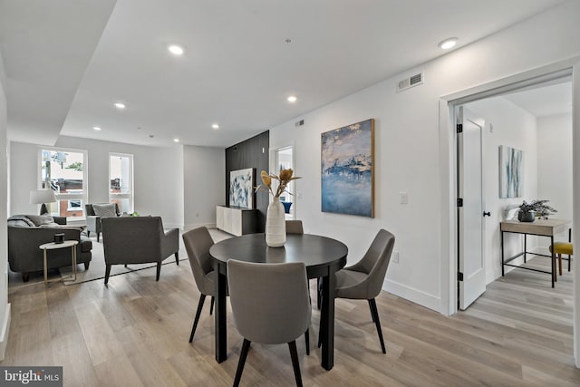 dining space with recessed lighting, light wood-style floors, visible vents, and baseboards