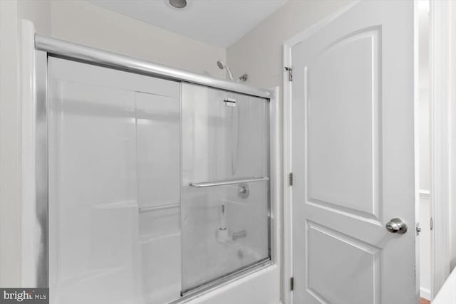 full bath with bath / shower combo with glass door