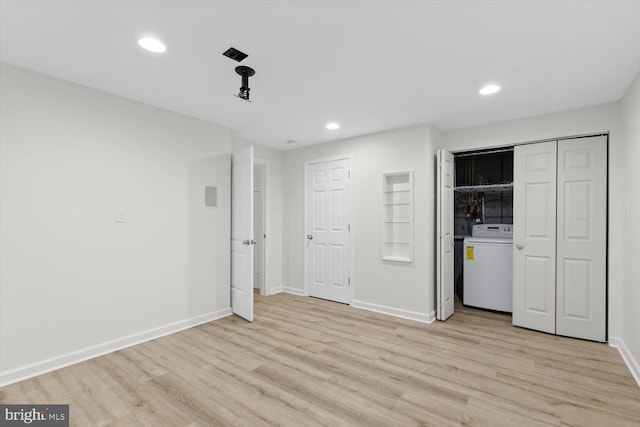 interior space featuring recessed lighting, washer / dryer, light wood-type flooring, and baseboards