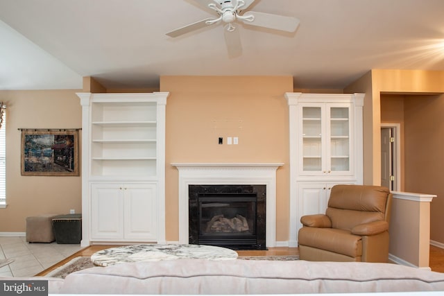 83 Huntington Dr, Jackson, NJ 08527 - living room featuring tile patterned floors, baseboards, a high end fireplace, and ceiling fan